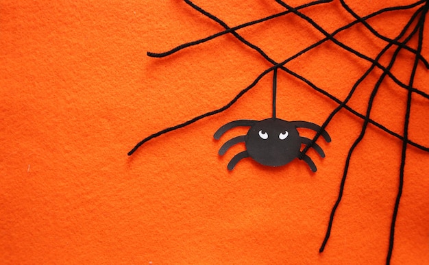 Orange Halloween background with spiders