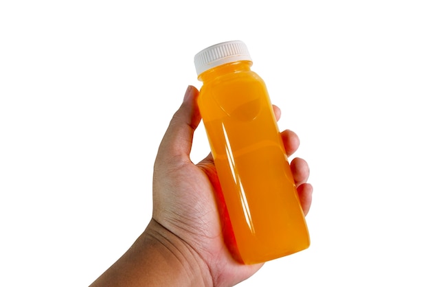 Orange juice bottle in hand isolated on white