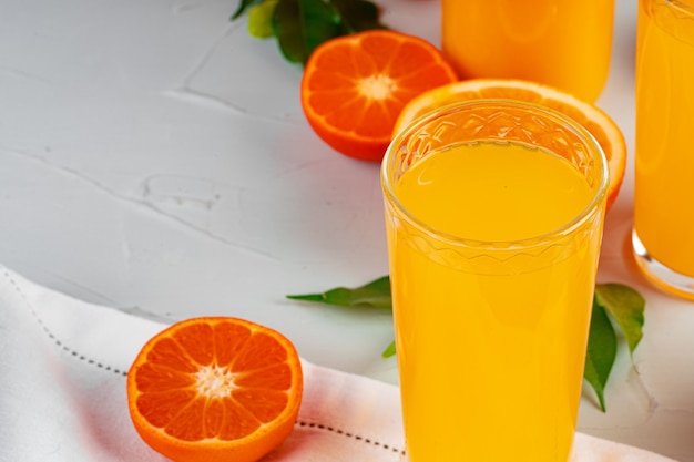 Orange juice cup on table close up