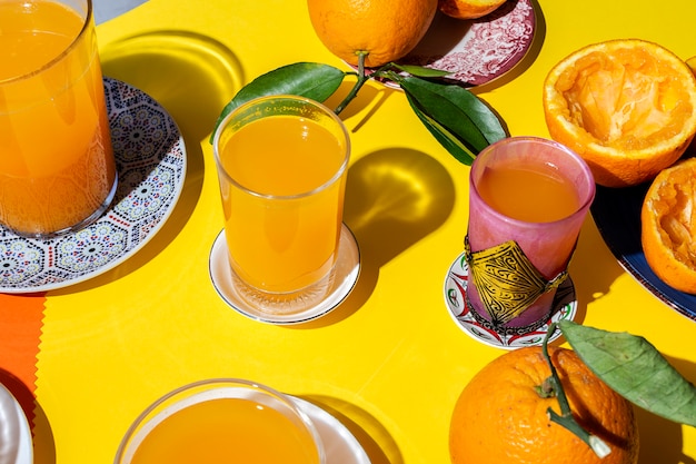 Orange juice from above on colored walls.