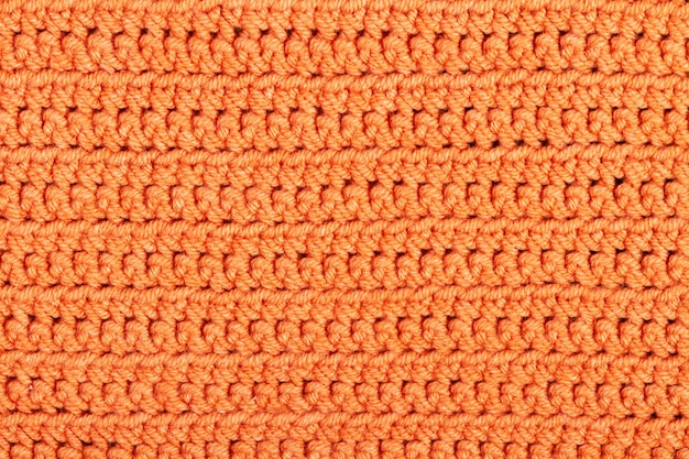 Orange Knitted fabric background or texture