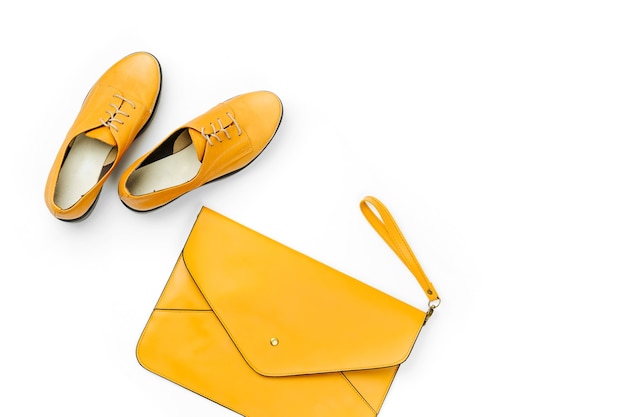 Orange ladies bag and stylish spring or autumn shoes. Flat lay, top view. Minimal fashion concept