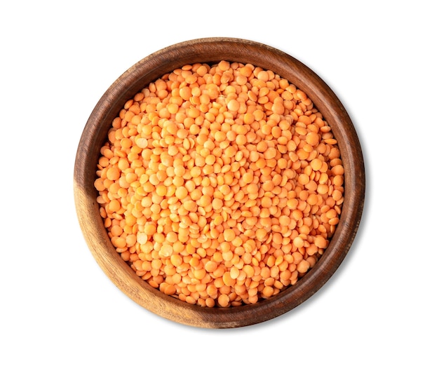 Orange lentil in a bowl isolated over white background