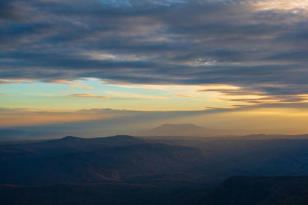 Orange light of the sunset over the mountain