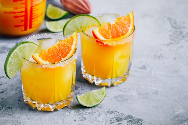 Orange Lime Margarita Refreshing summer drink with ice in glass