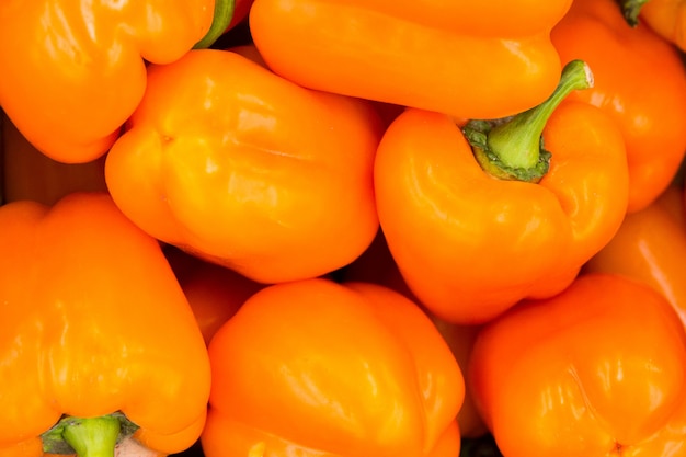 Photo orange peppers. texture of pepper. vegetables in the shop