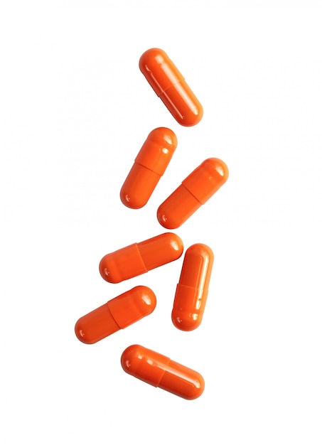 Orange pill capsules isolated  