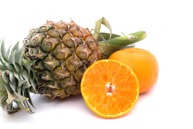 Orange and pineapple are placed on a white background