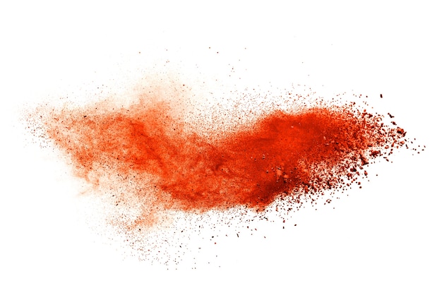 Orange powder explosion isolated on white  background