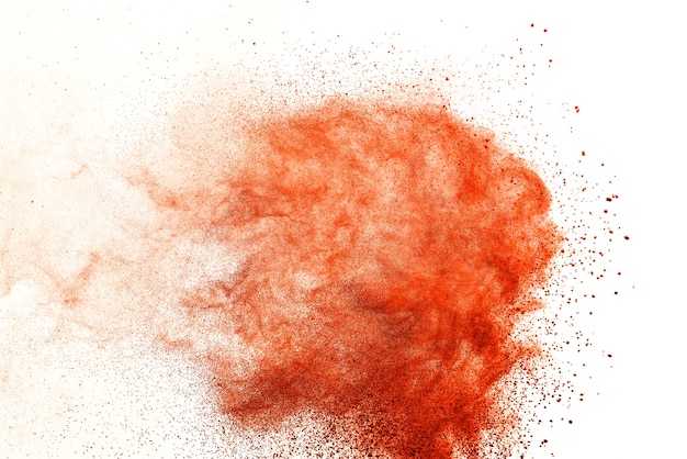 Orange powder explosion isolated on white  background