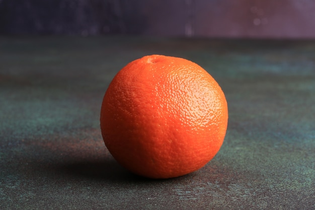 Orange on a rusty grunge background