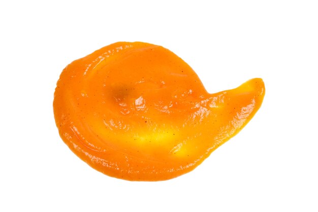 Orange sauce splashes isolated on white surface