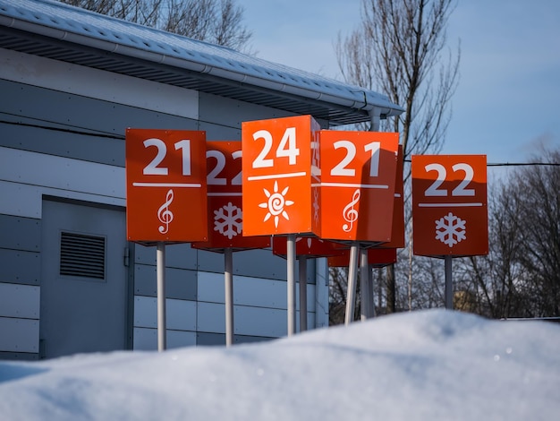 Orange signs are in the Parking lot of the store