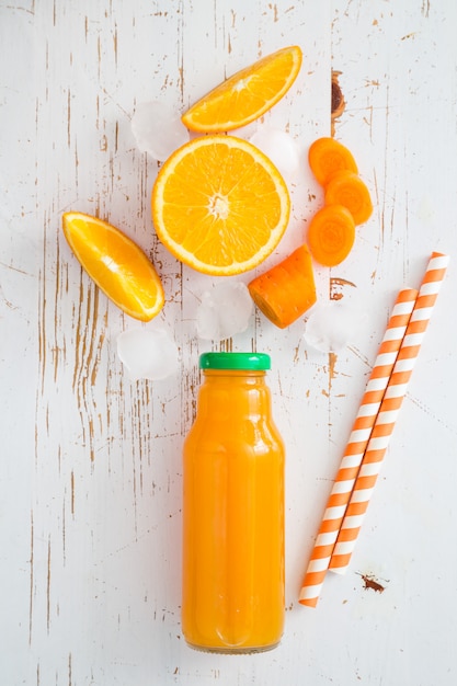 Orange smoothie on rustic wood  