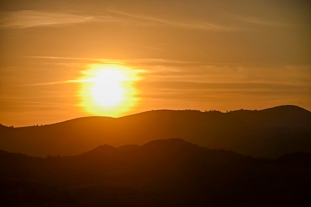 Orange sunset over the mountains of granada