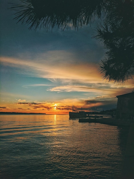 Orange sunset sky. summer. Scenic view to Adriatic sea in the evening. Natural background. Vacation.