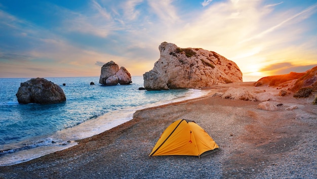 Orange tourist tent on the beach of Aphrodite in Cyprus A popular tourist destination Paphos Limassol Cyprus