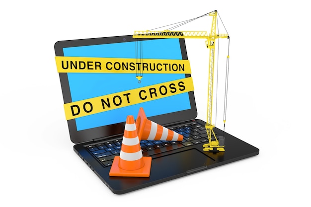 Photo orange traffic cones and yellow tower crane over laptop with under construction tape on a white background. 3d rendering