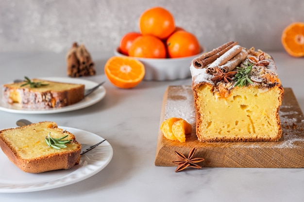 Orange yogurt loaf cake with spices and sugar powder