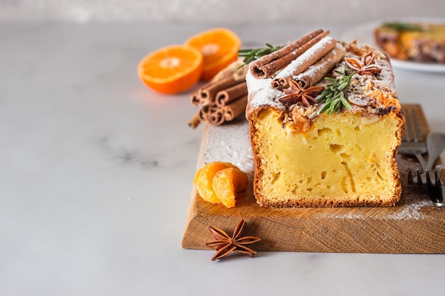 Orange yogurt loaf cake with spices and sugar powder