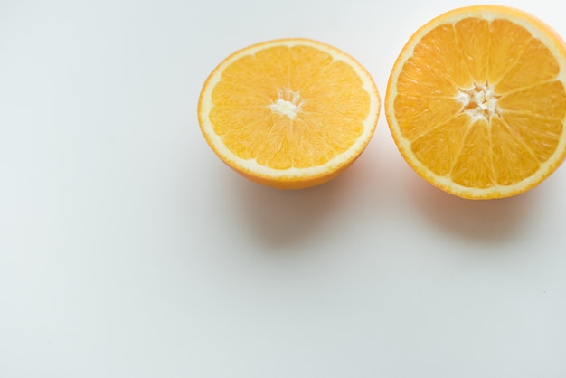 oranges on a white background cut orange