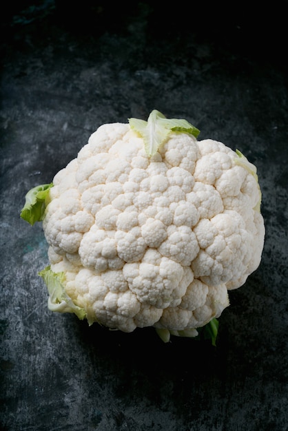 Oranic Cauliflower on  rustic metal backgroound. Organic food concept