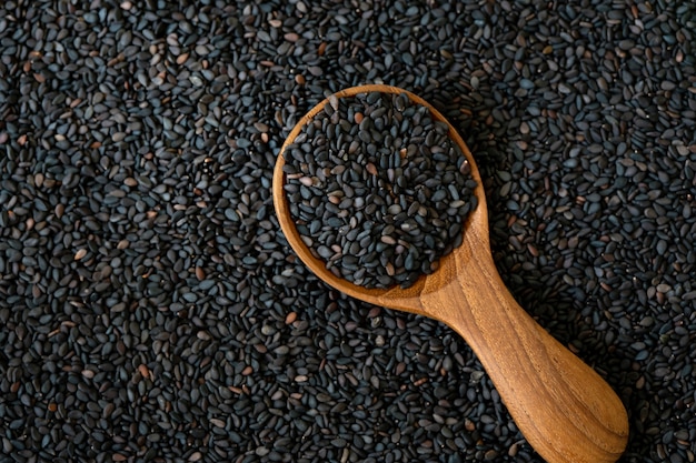 Organic a Black  sesame seeds in wooden spoon 