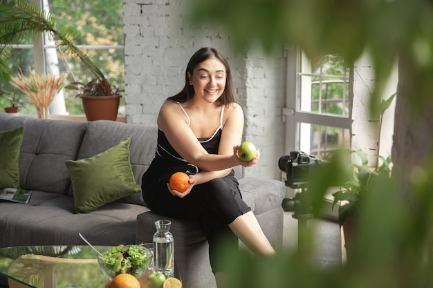 Photo organic. caucasian blogger, woman make vlog how to diet and lost weight