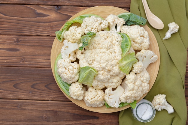 Organic cauliflower on wooden background