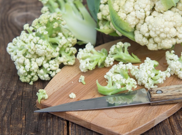 Organic cauliflower on a wooden table close up