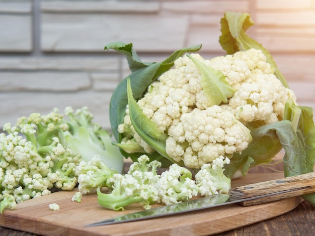 Organic cauliflower on a wooden table close up