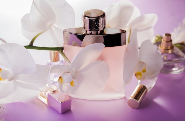 Organic cosmetics concept Bottles of perfume with orchid