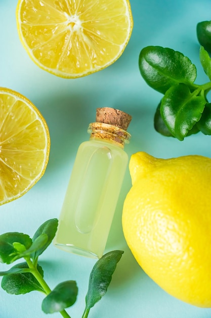 Organic cosmetics with lemon oil Spa products on a blue background