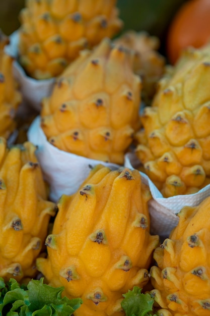 Organic exotic pitahaya or yellow dragon fruits, background