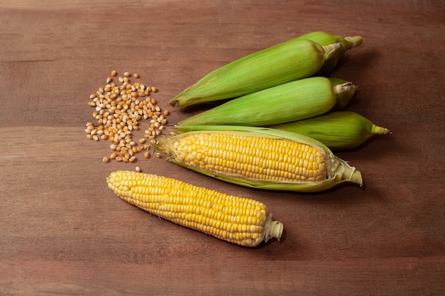 Organic fresh corncobs or corn ears on wood.Food for health. 