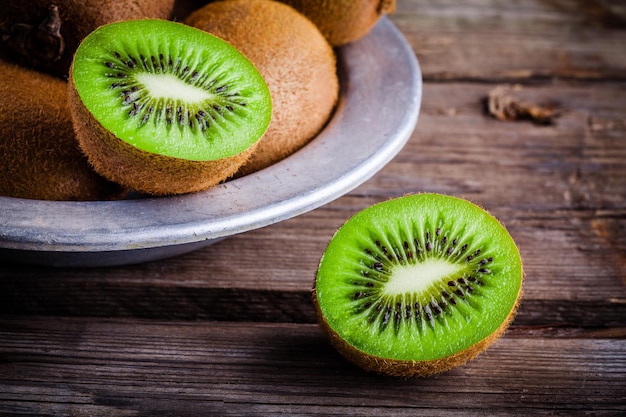 Organic fresh juicy kiwi on a rustic wooden background