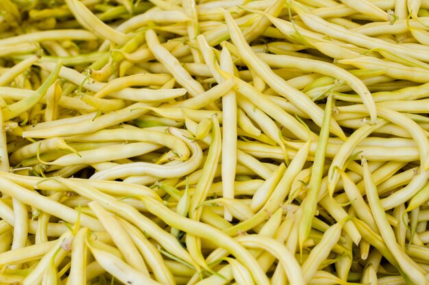 Organic green beans in a pile at the local farmer's  market.