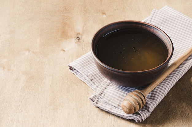 Organic honey on wooden table.