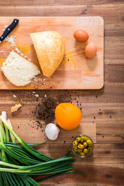 Organic ingredients on a wooden Table in the Kitchen.