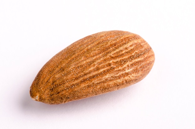 Organic Marcona almond with skin on white background