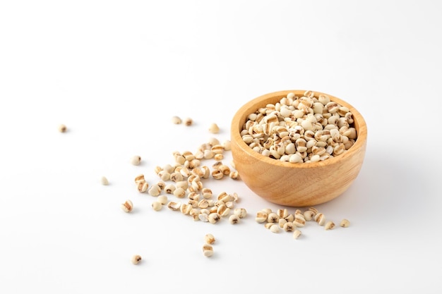 organic millet grains on white background