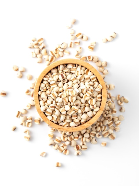 organic millet grains on white background