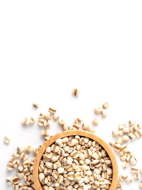 organic millet grains on white background