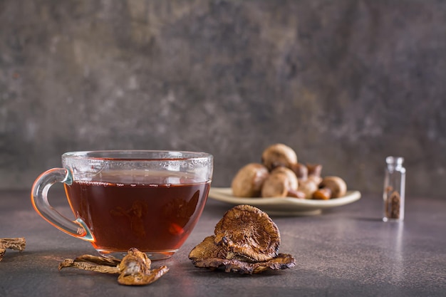 Organic mushroom tea in a cup for alternative herbal medicine