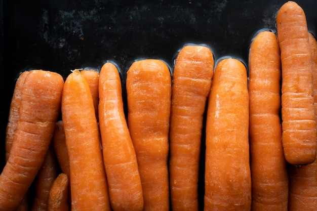 Organic raw carrots in water