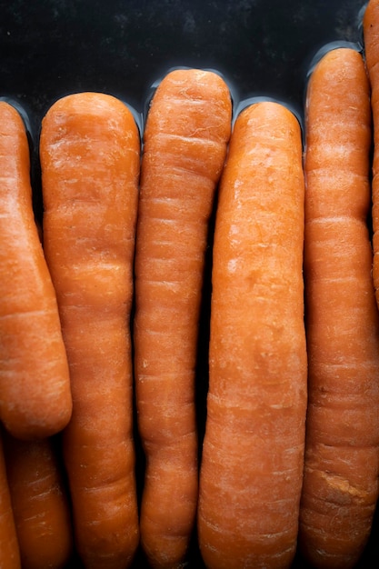 Organic raw carrots in water