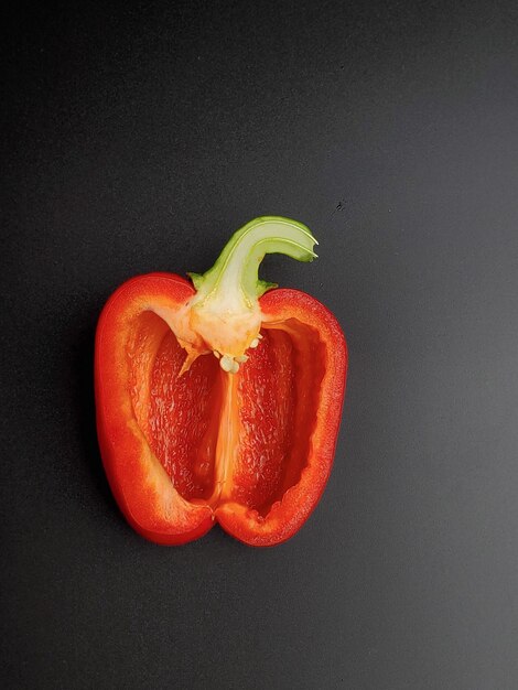 organic red pepper isolated on black