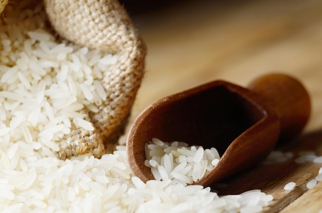 Organic rice grains in burlap sack with copy-space