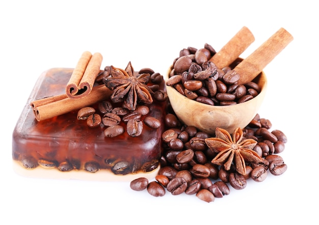 Organic soap with coffee beans and spices, isolated on white