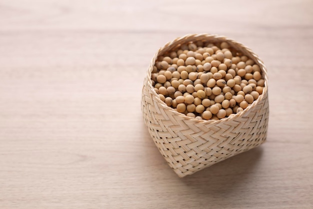 Organic Soybean in basket on wood table Protein nutrition ingredient for vegetarian